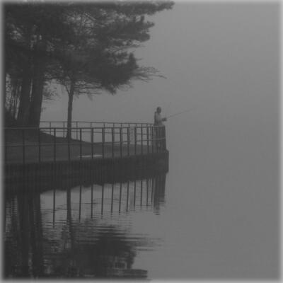 Lone fisherman in the fog