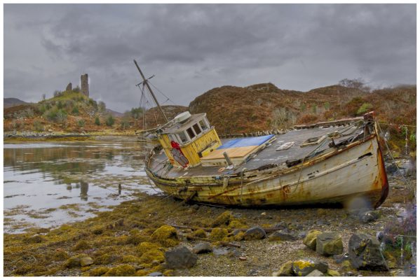 A derelict boat and derelict castle
