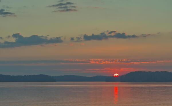 Red rubber ball sunrise over Lake Lanier