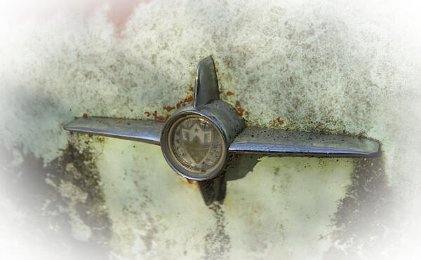 Emblem on the back of some old car.  Brand unknown