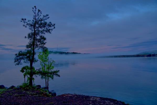 Foggy sunrise over Buford Dam