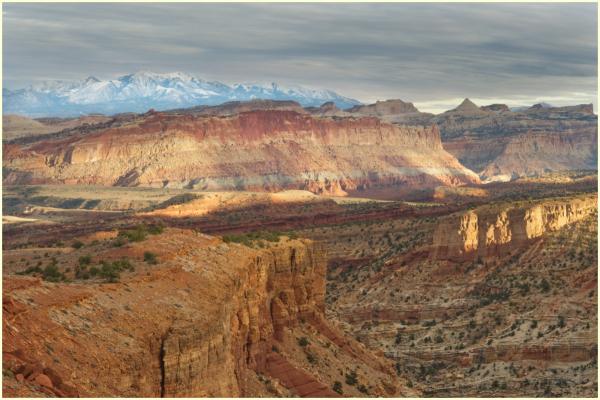 A view from Sunset Point as the afternoon sun lights up the cliffs