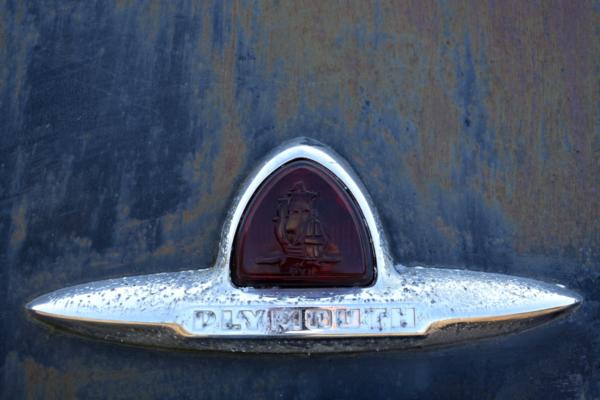 The Plymouth emblem.  This is on the back of a late 1940's or early 1950's car, the first I remember as a child.